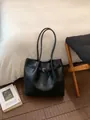 Large black shoulder tote bag with decorative buckle and long straps for daily commute - No Pendant / Black