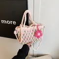 Handmade crochet woven tulip bucket bag in white and pink with a floral charm - Pink Small