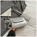Silver metallic crossbody bag with ruffled texture and pearl lace decorative details - With Charm / Silver