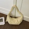 Borsa a mezzaluna giallo crema in pelle testurizzata con tracolla annodata - Tipo standard / Giallo