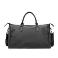 Schwarze Shopper Tasche mit Carbon-Textur, Ledergriffen und verstellbarem Umhängeriemen - Schwarz