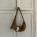 Brown half-moon crossbody bag in synthetic leather with unique knotted strap and horse charm - With Pendant / Brown
