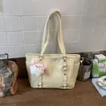 Cream tote bag with silver studs, side pockets and cute white plush sheep charm accessory - No Pendant / Yellow