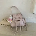 Pink faux leather backpack with bow drawstring and a cute white rabbit pendant - No Pendant / Pink