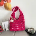 Handmade crochet tote bag in vibrant rose red with hollow knit pattern and floral charm - Rose Red
