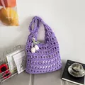 Purple hollow woven tote bag with white tulip charms and green bow decoration - Purple