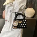 Mini sac à main noir à pois avec charme monstre et fermoir métallique pivotant élégant - Sans pendentif / Noir