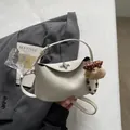 Chic white croissant crossbody bag with cute plush bear charm and silver twist lock - Beige with Pendant