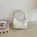Detail of off-white faux leather handbag showing pleated handle and brand logo - White