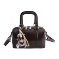 Glossy dark coffee pillow bag with dual top handles and decorative charm detail - With Pendant Style / Brown