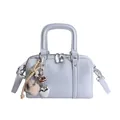 Light blue-grey pillow bag with plush charm and silver hardware shown in studio shot - With Pendant Style / Blue