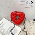 Red sequin heart-shaped crossbody bag with quilted pattern and metal eagle head - Red