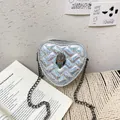 Silver holographic heart-shaped quilted crossbody bag with a metallic eagle head detail - Silver