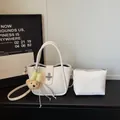 White litchi pattern bucket bag set with plush bear pendant and matching small pouch - White