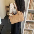 Brown geometric embossed tote bag with adjustable straps and cute bear charm pendant - With Pendant / Khaki