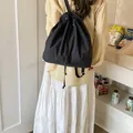 Versatile black drawstring backpack for women in a casual minimalist sporty style - Black
