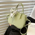 Pistachio green faux leather crossbody bag with silk scarf handle and lychee texture - Green