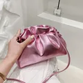 Metallic pink drawstring crossbody bag with pleated texture and thin leather shoulder strap - Pink