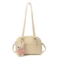 Cream lychee textured square shoulder bag with a cute plush rabbit charm on white background - Charm / Off White