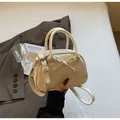 Detail of cream white leather handbag with 3D bow design and slim shoulder strap - Off White