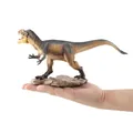 Realistic feathered Yutyrannus dinosaur model toy on rock base held in hand - Realistic Yutyrannus Model (JZD014)