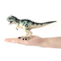 Vista dettagliata del dinosauro Carnotaurus tenuto in mano per confronto dimensioni - Blu (JZD005)