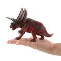 Realistic red and black Pentaceratops dinosaur toy model shown in hand for scale - Pentaceratops