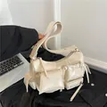 Chic cream white motorcycle shoulder bag with multiple pockets in glossy finish - White