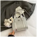Silver bucket bag with wave texture, square metal plaque and plush puppy charm - Large With Charm Silver Wave Texture