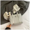 Silver woven bucket bag with metallic texture, mirror leather trim and plush bear charm - Large With Charm Silver
