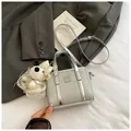 Silver bucket bag with glitter fabric finish, metallic trim and cute puppy charm - Small With Charm Silver