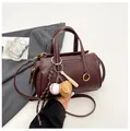 Deep burgundy shoulder bag with baseball charms and textured faux leather finish - Wine Red (With Pendant)