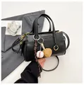 Matte black leather Boston bag with baseball charm and gold hardware strap - Black with Charm