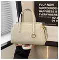 Chic beige crossbody handbag with golden metal rings and adjustable shoulder strap - White without Charm