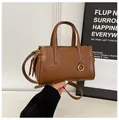 Retro caramel brown leather shoulder bag with gold metal buckle and adjustable strap - Coffee without Charm
