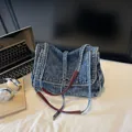 Large capacity blue denim tote bag with leather straps and silver buckle for daily use - Blue