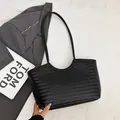 Structured black woven tote bag with V-shaped pattern and long shoulder straps - Black