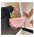 Pink semi-circular leather saddle bag with gold ring handle and detachable strap - Pink