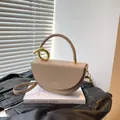 Minimalist tan saddle bag with golden handle and fashion lettering on leather - Khaki