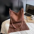 Bohemian dark brown suede shoulder bag with long fringes and retro aesthetic style - Coffee