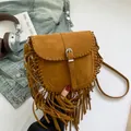 Bohemian brown faux suede saddle bag with fringe tassels and woven stitch details - Tan
