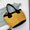 Bolso tote grande de ante en diseño bicolor amarillo y negro para uso diario - Amarillo
