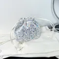 Sparkling silver sequin drawstring bucket bag with elegant crossbody shoulder strap - White