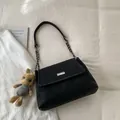Minimalist black flap shoulder bag with silver hardware and plush rabbit charm accessory - With Pendant / Black