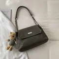 Olive green frosted leather shoulder bag with silver hardware and plush bear charm - With Pendant / Gray