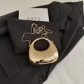 Chic mini gold crescent evening bag in high-gloss acrylic with metal chain strap - Gold