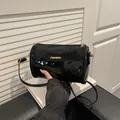 Minimalist black patent leather cylinder shoulder bag with gold 'FASHION' lettering - Glossy Style / Black