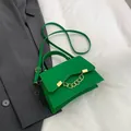 Elegant bright green crossbody bag with gold chain and flap closure in matte finish - Green