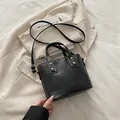 Quilted black bucket bag with gold studs and adjustable shoulder strap for casual wear - Black