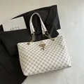 Large cream tote bag with brown monogram pattern and golden deer pendant detail - Vintage Monogram White